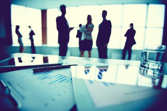 close-up-statistics-with-employees-background